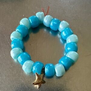 Blue and White Beaded Bracelet with Bird Charm